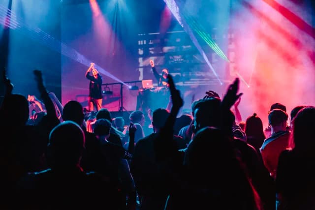 Concert crowd with purple lighting